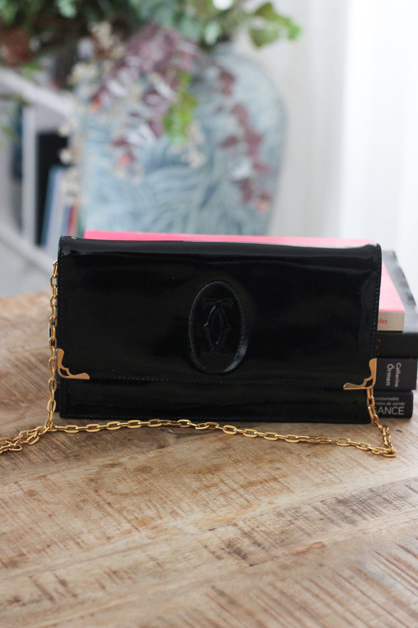 Pochette Cartier en cuir verni